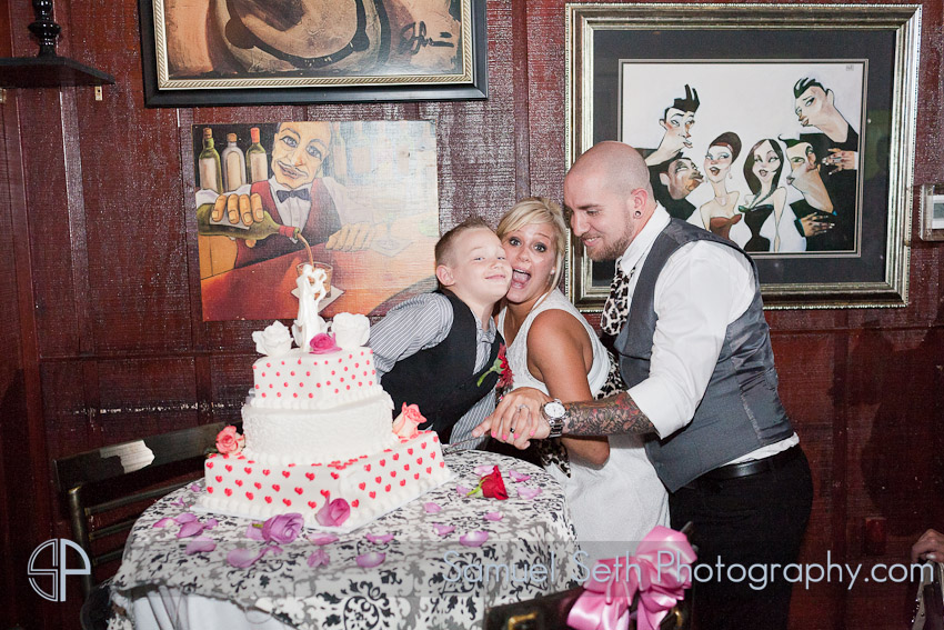 Erin and Nick Bar wedding Cake cut