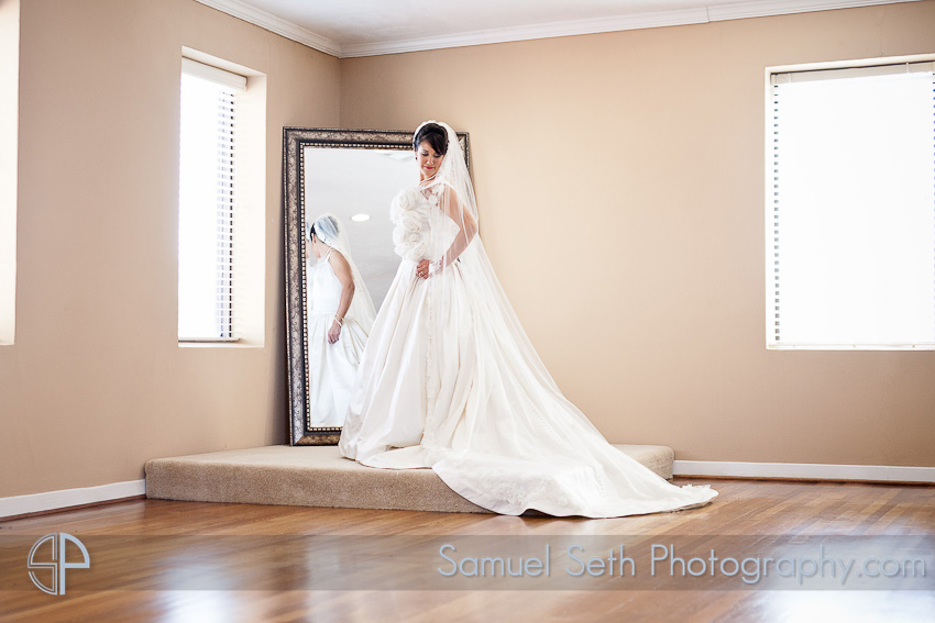 Bride Looking in Mirror The heights villa Bridal Portraits